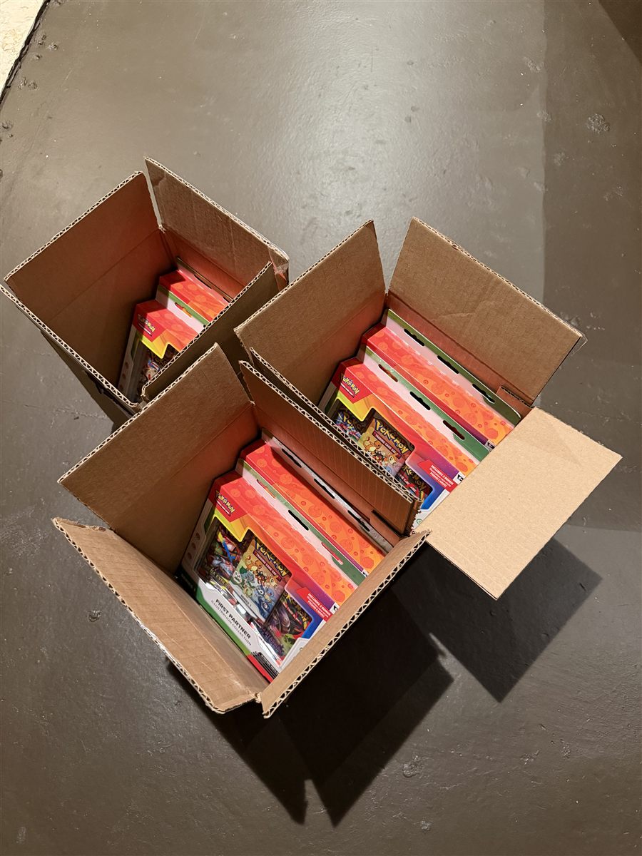 Pokemon collections packed in several cardboard boxes